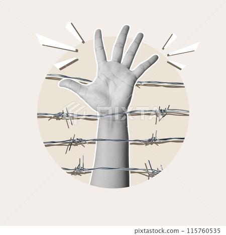 A human hand raised in the air in the middle of barbed wire 115760535