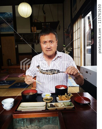 Eat grilled trout skewers at a traditional Japanese restaurant 115761630