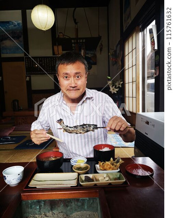 Eat grilled trout skewers at a traditional Japanese restaurant Eat grilled trout skewers at a traditional Japanese restaurant 115761632