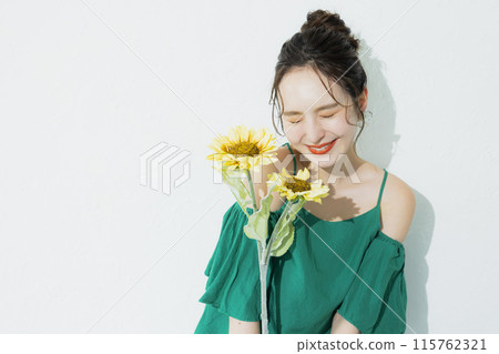 A woman with sunflower A woman with sunflower 115762321