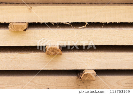 Stack of wooden boards closeup background photo 115763169