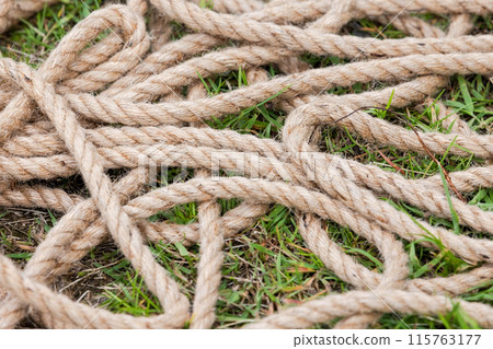 Nautical rope lies on the ground, close up Nautical rope lies on the ground, close up 115763177