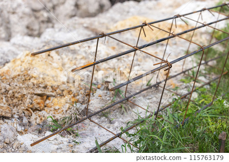 Reinforcement cage for concrete basement lays on the ground Reinforcement cage for concrete basement lays on the ground 115763179