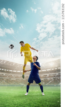 Vertical image of tow competitive men, soccer players in yellow and blue uniform competing for victory, playing. 3D render of stadium with tribune 115763192