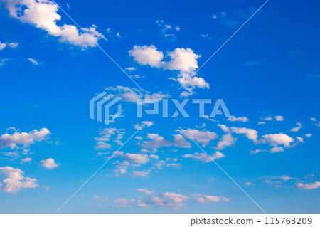 white cumulus clouds on a blue sky. wonderful nature background of fresh air condition in morning light. bright weather forecast. clear atmosphere 115763209
