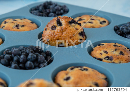 Fresh baked blueberry muffins. Tasty Sweet cupcake. Pastry homemade dessert. Berry pie in silicone muffin tin. Healthy vegan cupcakes Baked in reusable silicon forms Fresh baked blueberry muffins. Tasty Sweet cupcake. Pastry homemade dessert. Berry pie in silicone muffin tin. Healthy vegan cupcakes Baked in reusable silicon forms 115763704