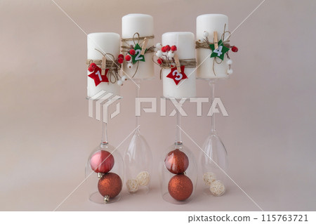 New year and Christmas preparation. Four-week advent candles on table. Handmade eco-friendly decor. Sustainable Christmas decoration 115763721