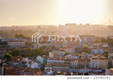 Sunset contre-jour view of Lisbon from Miradouro da Senhora do Monte viewpoint. Lisbon, Portugal 115763781