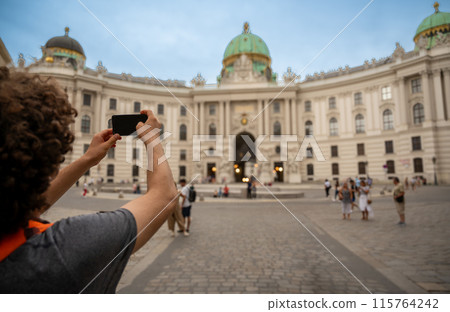 Vienna,Austria,August 18 2022. In a cafe in the old town portrait of a nice caucasian boy looking at the camera. Positivity and self-confidence. 115764242
