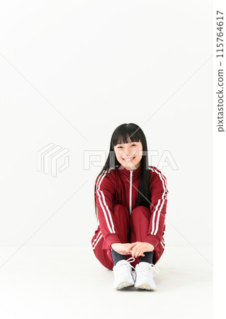 High school girl, jersey, sitting 115764617