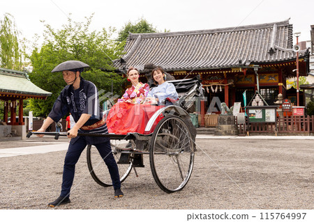 A foreign woman and a Japanese woman in kimono sightseeing in Asakusa on a rickshaw A foreign woman and a Japanese woman in kimono sightseeing in Asakusa on a rickshaw 115764997