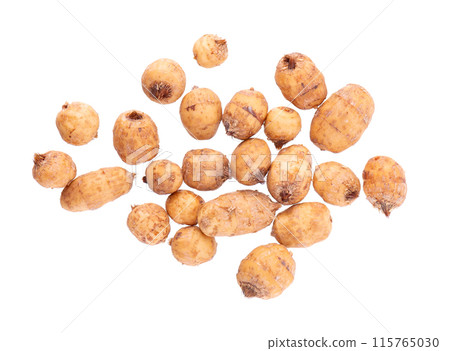Tiger nuts isolated on white background. Pile of chufa nuts, earth almond or chufa sedge. Cyperus esculentus. Top view. Tiger nuts isolated on white background. Pile of chufa nuts, earth almond or chufa sedge. Cyperus esculentus. Top view. 115765030