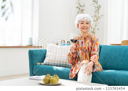 Senior woman relaxing in the living room 115765454