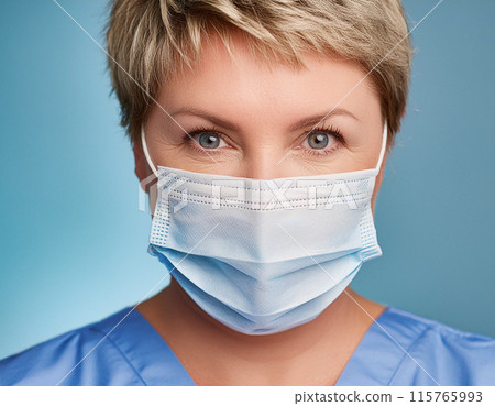 Female Healthcare Professional in Uniform Wearing Face Mask 115765993