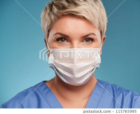 Female Healthcare Professional in Uniform Wearing Face Mask Female Healthcare Professional in Uniform Wearing Face Mask 115765995