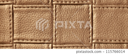 Texture of brown leather background with square pattern and stitch, macro. Abstract backdrop from bronze textile 115766014
