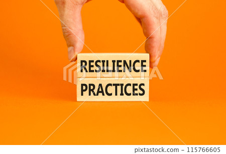 Resilience practices symbol. Concept word Resilience practices typed wooden blocks. Beautiful orange table orange background. Businessman hand. Business and resilience practices concept. Copy space. Resilience practices symbol. Concept word Resilience practices typed wooden blocks. Beautiful orange table orange background. Businessman hand. Business and resilience practices concept. Copy space. 115766605