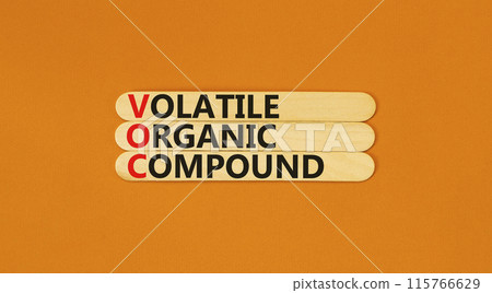 VOC volatile organic compound symbol. Concept words VOC volatile organic compound on beautiful wooden stick. Beautiful orange background. Business VOC volatile organic compound concept. Copy space. 115766629