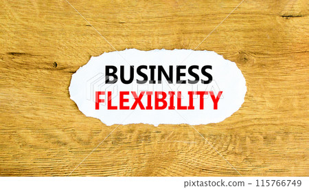 Business flexibility symbol. Concept words Business flexibility on beautiful white paper. Beautiful wooden wall background. Business flexibility concept. Copy space. Business flexibility symbol. Concept words Business flexibility on beautiful white paper. Beautiful wooden wall background. Business flexibility concept. Copy space. 115766749