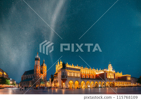 Krakow, Poland. Evening Night View Of St. Mary's Basilica And Cloth Hall Building. Famous Old Landmark Church Of Our Lady Assumed Into Heaven. UNESCO World Heritage Site 115768109
