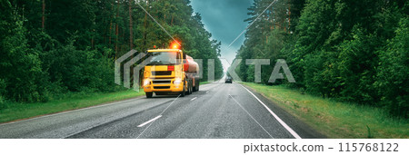 Tank Truck Or Tanker Truck, Transporting Gasoline On Country Road, Freeway. Asphalt Motorway, Against Background Of Forest Landscape. Business Transportation And Trucking Industry 115768122