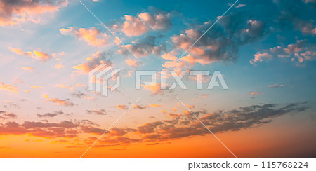 Sunset Sunrise Sky Background. Natural Bright Dramatic Sky In Sunset Dawn Sunrise. Yellow And Pink Colors Sunset Sunrise Sky Background. Natural Bright Dramatic Sky In Sunset Dawn Sunrise. Yellow And Pink Colors 115768224