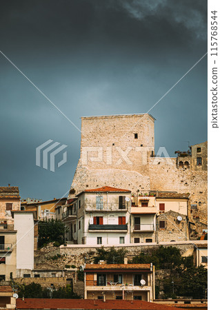 Monte San Biagio, Italy. Old wall, Residential Area. Cityscape In Autumn Day Under Blue Sky Monte San Biagio, Italy. Old wall, Residential Area. Cityscape In Autumn Day Under Blue Sky 115768544