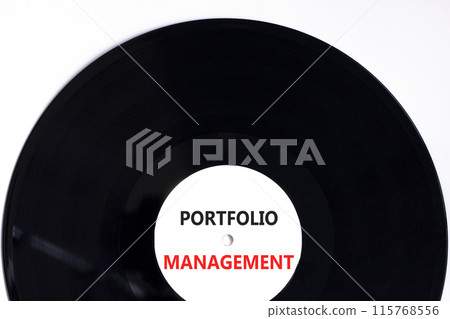 Portfolio management symbol. Concept words Portfolio management on beautiful white black vinyl disk. Beautiful white paper background. Business Portfolio management concept. Copy space. Portfolio management symbol. Concept words Portfolio management on beautiful white black vinyl disk. Beautiful white paper background. Business Portfolio management concept. Copy space. 115768556