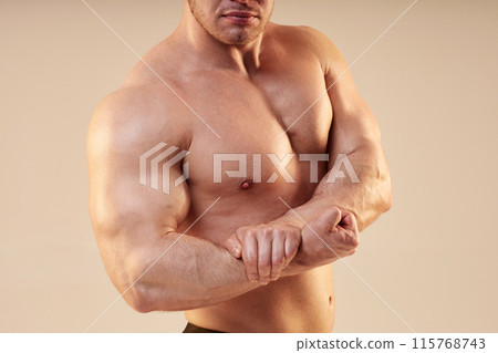 Cropped shot of athletic unrecognizable man striking side chest pose in studio on neutral background, copy space 115768743