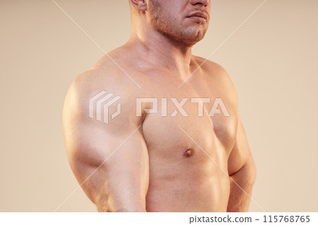 Cropped shot of strong mans body topless using arm muscles. Unrecognizable pumped bodybuilder showing triceps and chest musculature isolated on neutral background, copy space Cropped shot of strong mans body topless using arm muscles. Unrecognizable pumped bodybuilder showing triceps and chest musculature isolated on neutral background, copy space 115768765