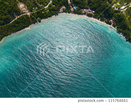 Top view of sunlight reflection over turquoise water. Samal Island. Davao, Philippines. Top view of sunlight reflection over turquoise water. Samal Island. Davao, Philippines. 115768881
