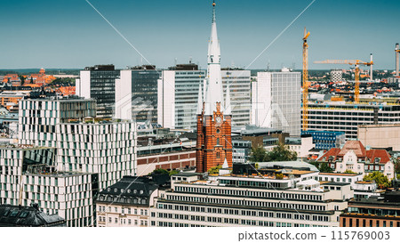 Stockholm, Sweden. Elevated View Of St. Clara Or Saint Klara Church In Summer Sunny Modern Cityscape Skyline Stockholm, Sweden. Elevated View Of St. Clara Or Saint Klara Church In Summer Sunny Modern Cityscape Skyline 115769003