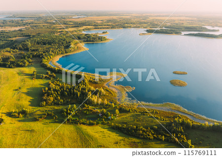 Braslaw Or Braslau, Vitebsk Voblast, Belarus. Aerial View Of Nedrava Lake, Green Forest And Meadow Landscape In Sunny Autumn Morning. Top View Of Beautiful European Nature From High Attitude. Bird's 115769111