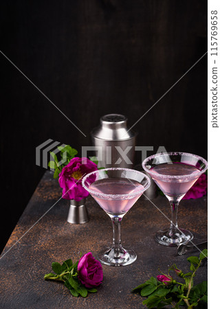 Pink martini cocktail with rose syrup Pink martini cocktail with rose syrup 115769658