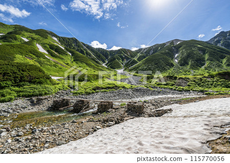 Jodo Bridge and the Tateyama mountain range seen from Raichozawa Campsite, Tateyama Town, Toyama Prefecture 115770056