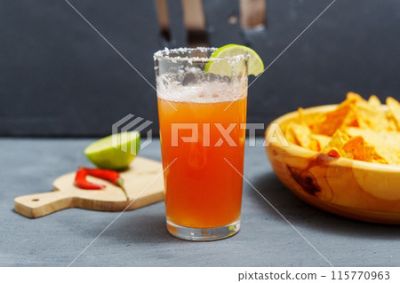 Michelada, Mexican alcoholic cocktail with beer, lime juice, tomato juice Michelada, Mexican alcoholic cocktail with beer, lime juice, tomato juice 115770963