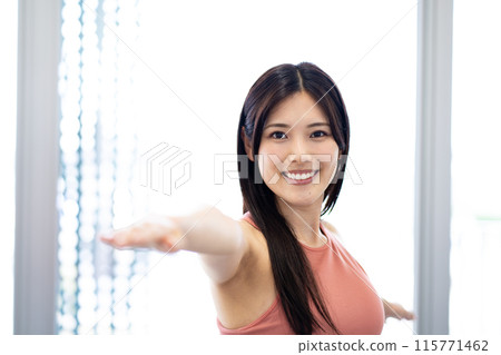 Young woman doing yoga (opening arms, refreshing, stretching, beauty) Young woman doing yoga (opening arms, refreshing, stretching, beauty) 115771462