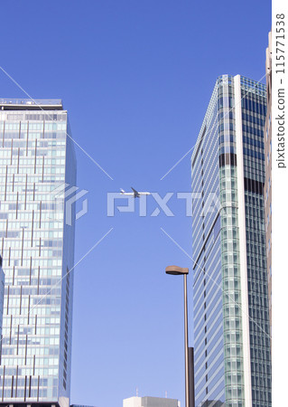 Shibuya skyscrapers and passenger planes 115771538