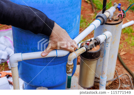 Water is being connected to water supply well system pump house Water is being connected to water supply well system pump house 115771549