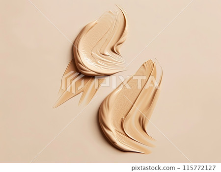Four strokes of pink cream swirl elegantly across a soft pink backdrop 115772127