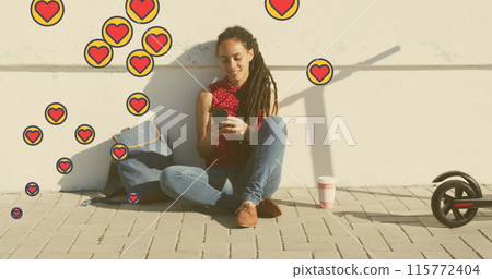 Multiple heart icons floating against african american woman using smartphone sitting on the street Multiple heart icons floating against african american woman using smartphone sitting on the street 115772404