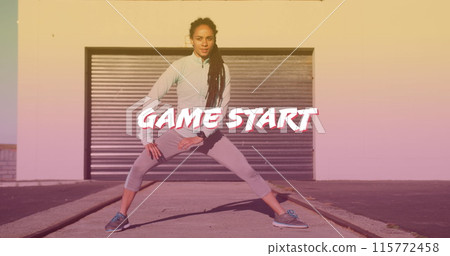 Game start text banner against african american fit woman performing stretching exercise outdoors 115772458