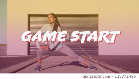 Game start text banner against african american fit woman performing stretching exercise outdoors Game start text banner against african american fit woman performing stretching exercise outdoors 115772459