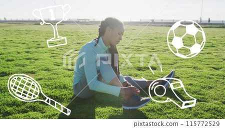 Sports concept icons against african american fit woman tying her shoe laces sitting on the grass Sports concept icons against african american fit woman tying her shoe laces sitting on the grass 115772529