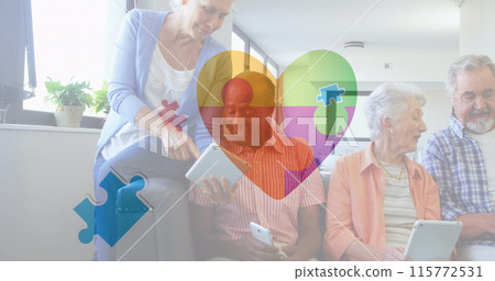 Image of colourful puzzle pieces heart beating over senior friends using electronic devices 115772531