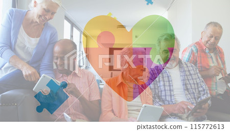 Image of colourful puzzle pieces heart beating over senior friends using electronic devices Image of colourful puzzle pieces heart beating over senior friends using electronic devices 115772613