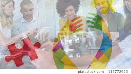 Image of colourful puzzle pieces ribbon over business colleagues using tablet Image of colourful puzzle pieces ribbon over business colleagues using tablet 115772623