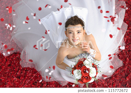 Bride in a pure white wedding dress with bright red petals Bride in a pure white wedding dress with bright red petals 115772672