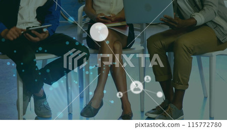 Image of padlock and connected icons over diverse coworkers discussing reports on laptop 115772780