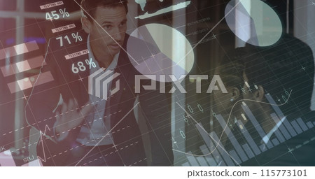 Digital composite of a Caucasian businessman discussing with colleagues in an office while graphs mo Digital composite of a Caucasian businessman discussing with colleagues in an office while graphs mo 115773101